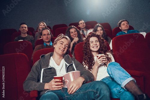 A young couple came to the cinema for a comedy. 
