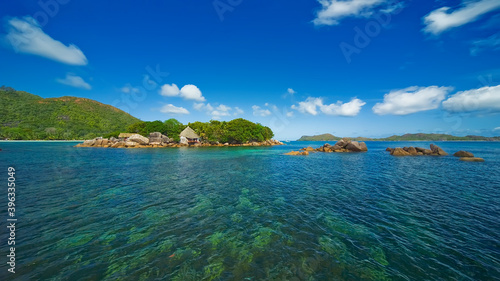 Fototapeta Naklejka Na Ścianę i Meble -  One of the small Seychelles Islands surrounded by clear turquoise water.