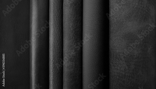 close up leather fabric catalog for interior uphostery works in dark black tone color. photo