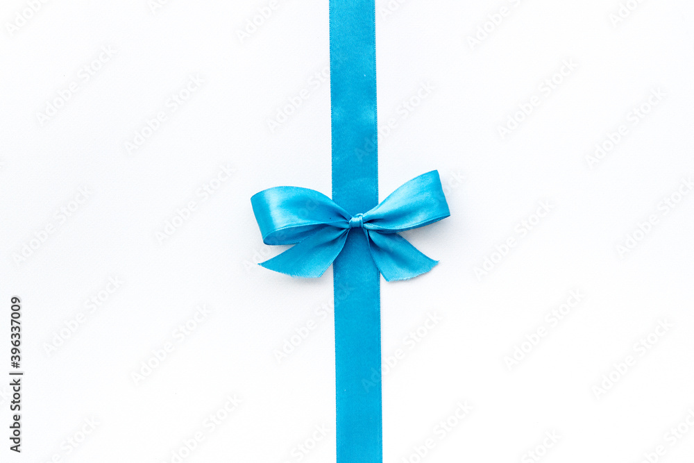 Blue ribbon with bow isolated on white. Top view, copy space Blue ribbon with bow isolated on white. Top view, copy space
