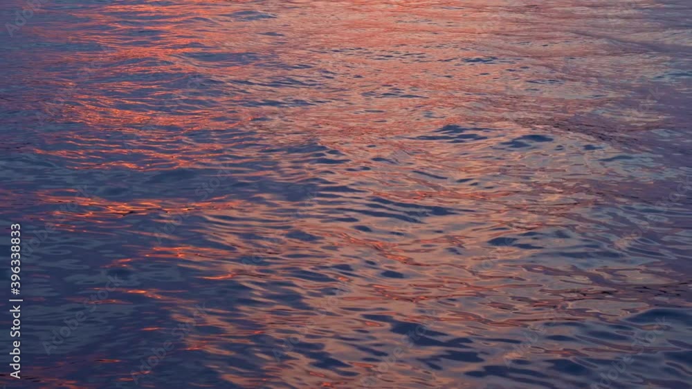 Beautiful sunset on the seaside. Amazing colors of the evening sky reflecting in the river. Small wawes in the water. Beautiful color of the sky . Beautiful sunset on the seaside. Amazing colors of the evening sky reflecting in the river. Small wawes in the water. Beautiful color of the sky .