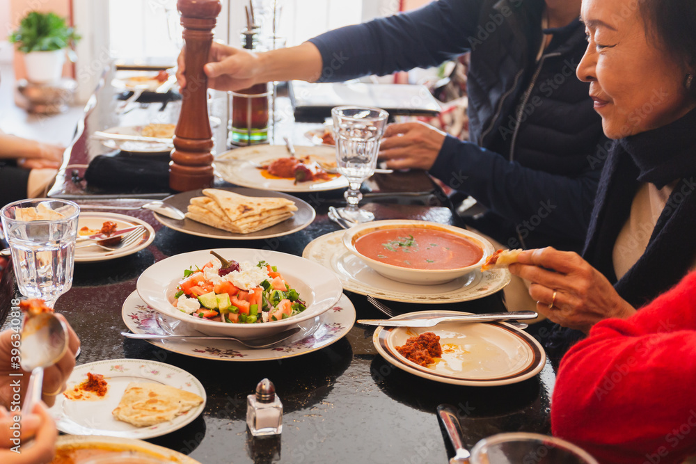 Family together having Christmas dinner in restaurant. Family together having Christmas dinner in restaurant.