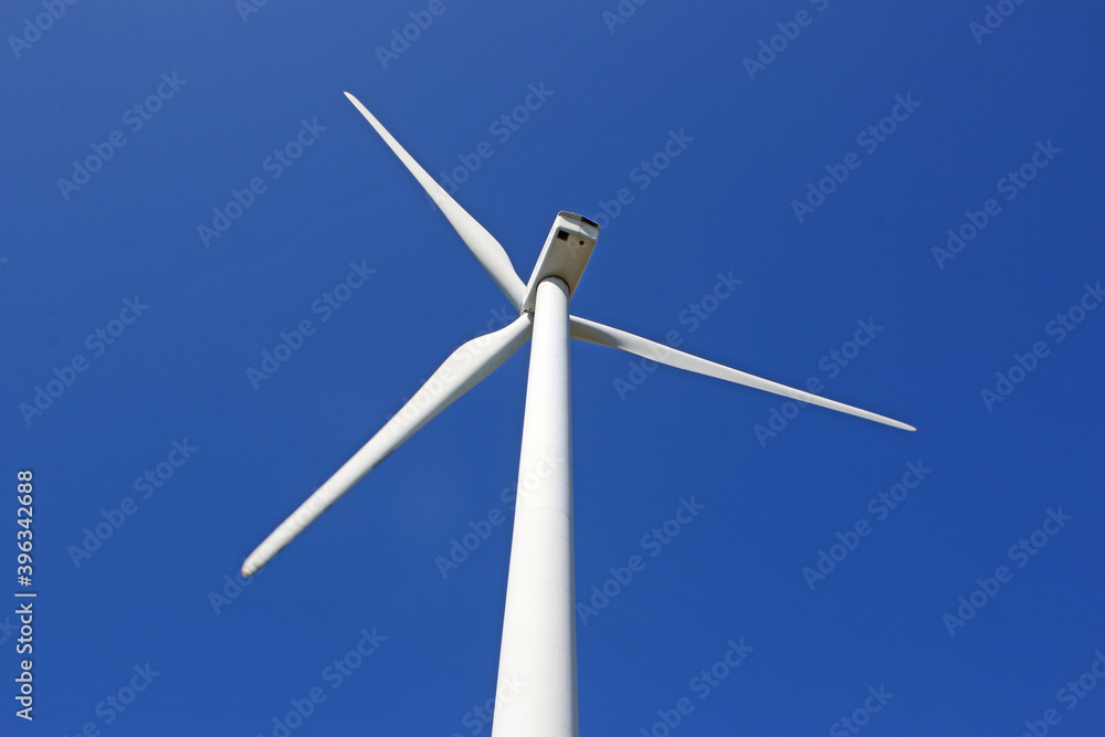 wind turbine against a blue sky wind turbine against a blue sky