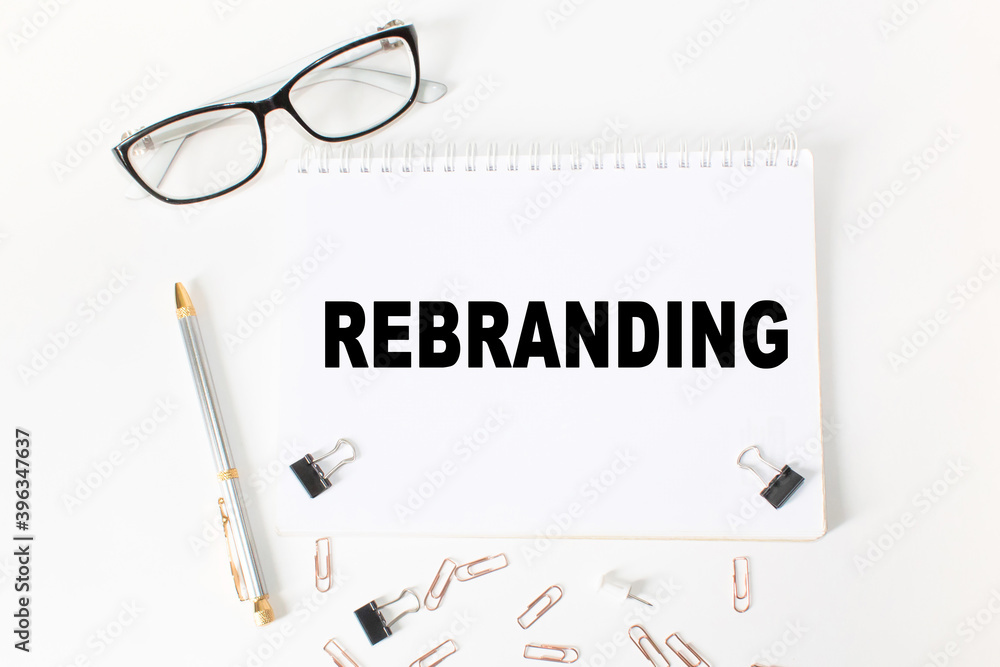 Notepad with inscriptions REBRANDING on a white background. business concept. Notepad with inscriptions REBRANDING on a white background. business concept.