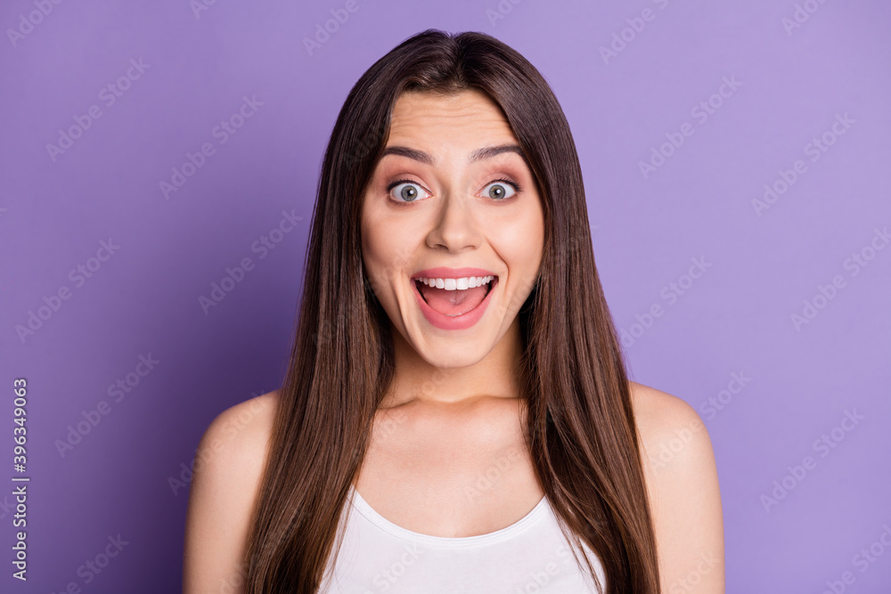 Photo portrait of excited girl with open mouth isolated on vivid violet colored background Photo portrait of excited girl with open mouth isolated on vivid violet colored background