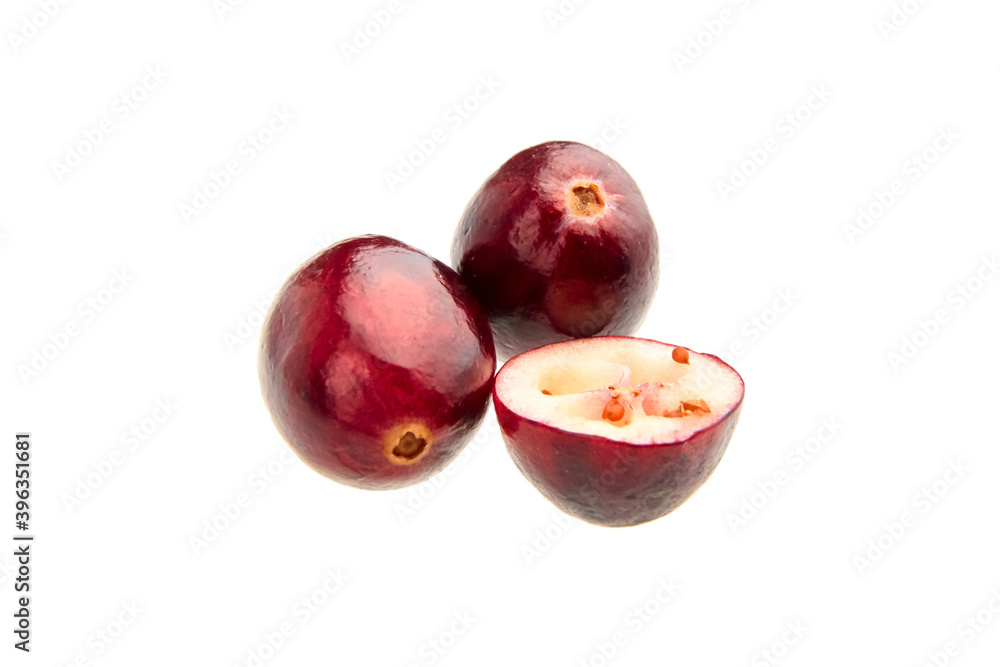 Halves and whole fresh red fall cranberries isolated on white Halves and whole fresh red fall cranberries isolated on white