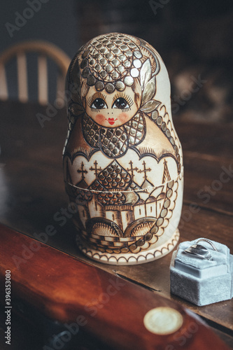 Russian doll on wooden table photo