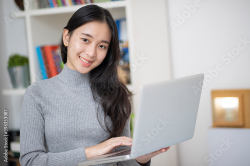 Work from home, Asian woman working with laptop computer at home office, Asia female shopping online, Happy girl learning by internet, study online education, e commerce business.