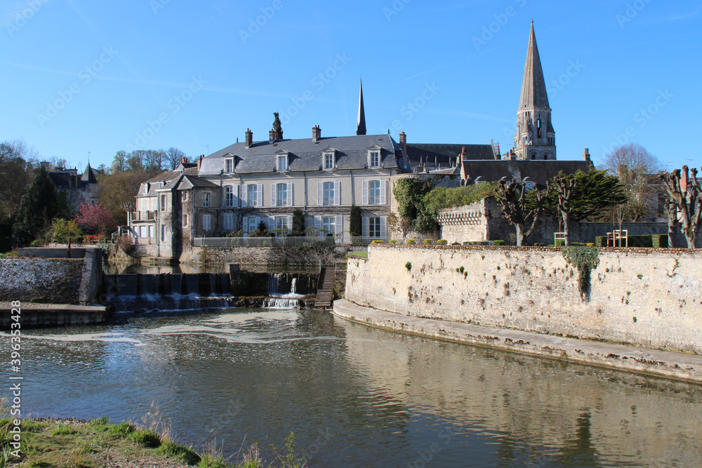 river loir and buildings in vendome (france)