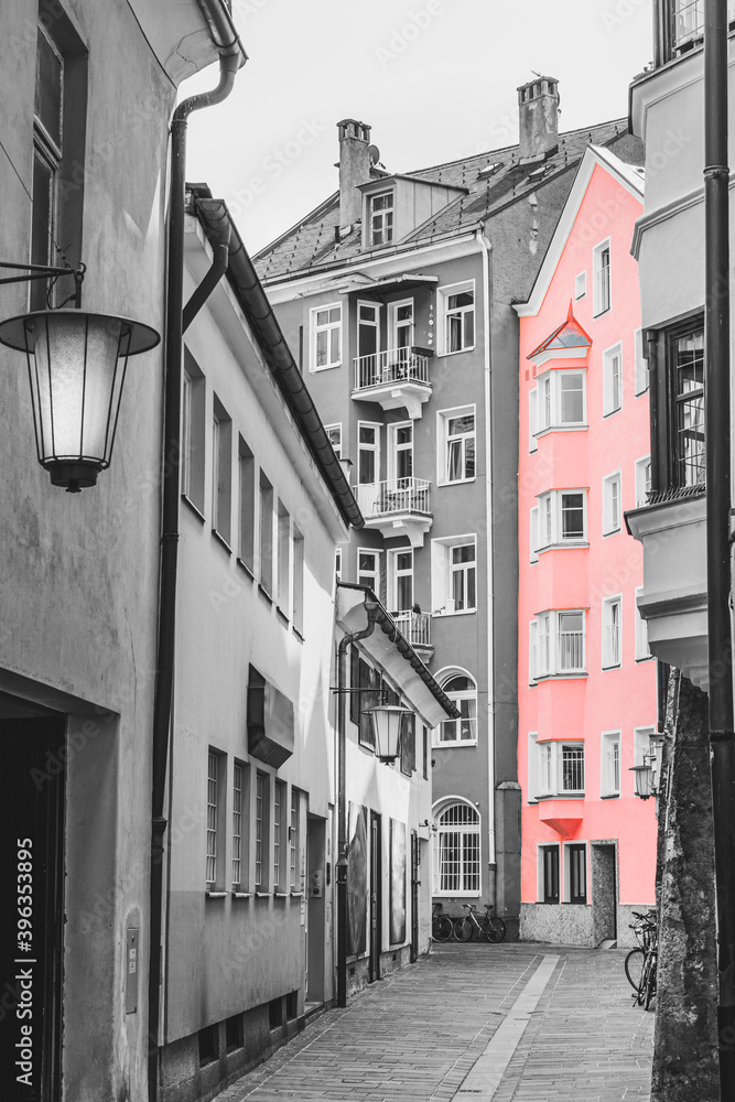 Old Pink Building in Salzburg Street, vintage building on cobblestone street in the old town. Black And White Toned. Austria