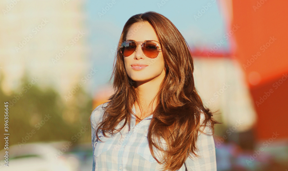 Summer portrait of beautiful young brunette woman in the city Summer portrait of beautiful young brunette woman in the city