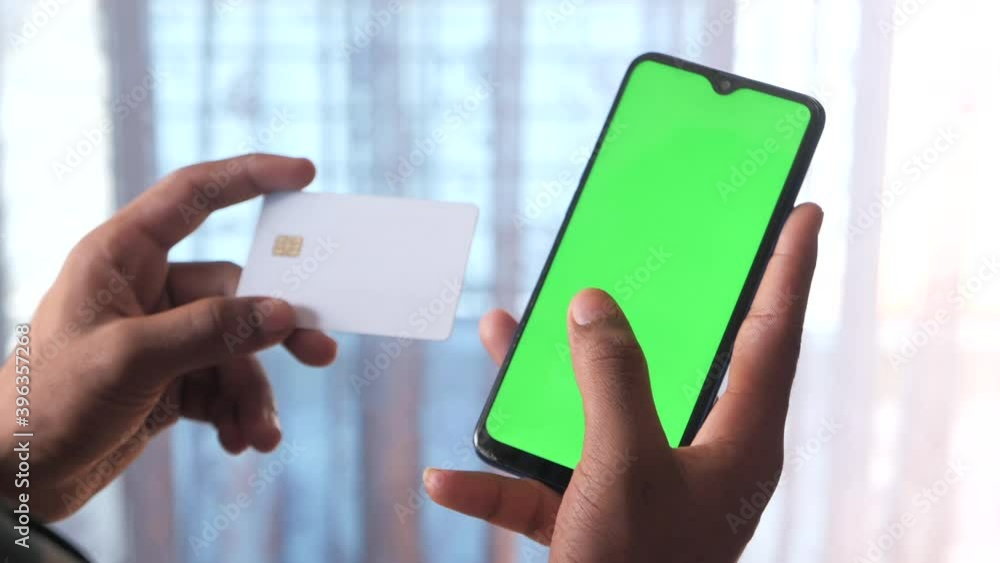 hand holding credit card paying online hand holding credit card paying online