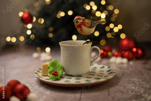 cup of coffee with christmas sparrow on top