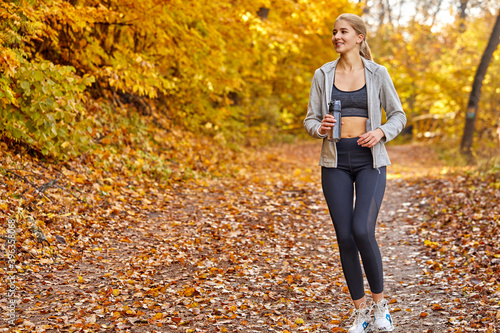 caucasian beautiful woman running in the forest, engaged in sport, run in the morning outdoors, enjoy © alfa27