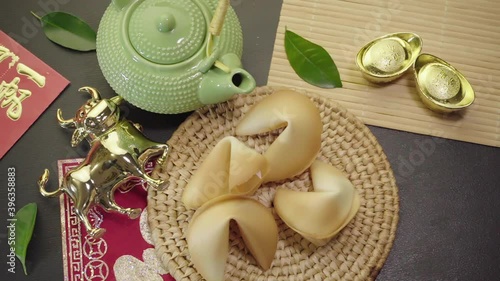 Year of the Ox. Fortune cookies, teapot, tea cups. Top view. Chinese New Year. 