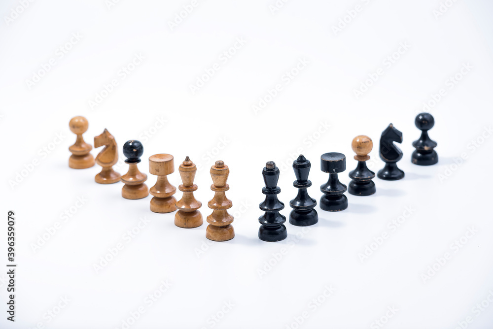 Old Chess Set - Full Set of 12 pieces on a white background with copy space
