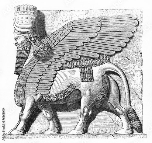 huge statue side view with human head and taurus body Khorsabad Lamassu chambrale (Antique Assyrian capital, North Iraq). Ancient grey tone etching style art by Flandin, Le Tour du Monde, 1861 photo