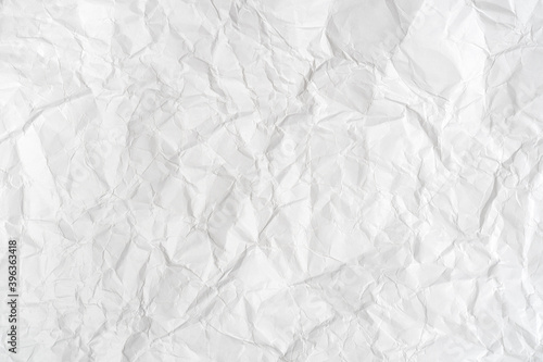 White sheet of crumpled paper for background with fine texture.