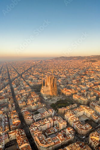Aerial drone shot of Barcelona city before sunrise golden hour