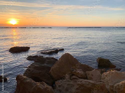 Sunset on the sea with sun rays