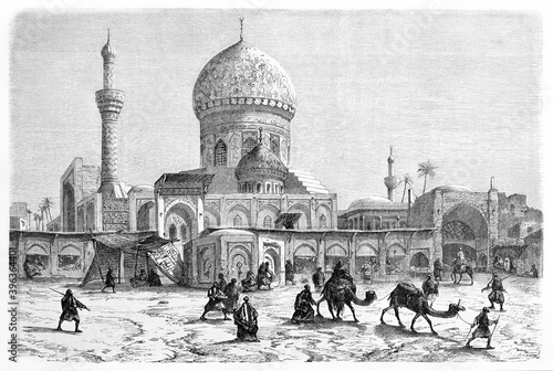 huge Midan mosque and the front square with arabian shops, people and camels, Baghdad. Ancient grey tone etching style art by Flandin, Le Tour du Monde, 1861 photo