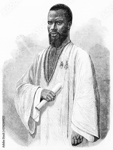 portrait of Hadji Moktar Bou el Mogdad in traditional white clothes and necklace, assessor of Saint-Louis Cadi, Senegal. Ancient grey tone etching style art by Hadamard and Gauchard, 1861 photo
