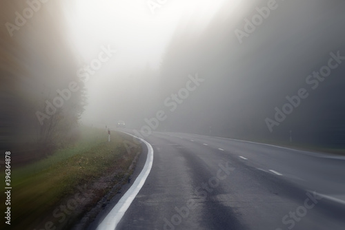 Driving on countryside road in fog. Illustration of dangers of d