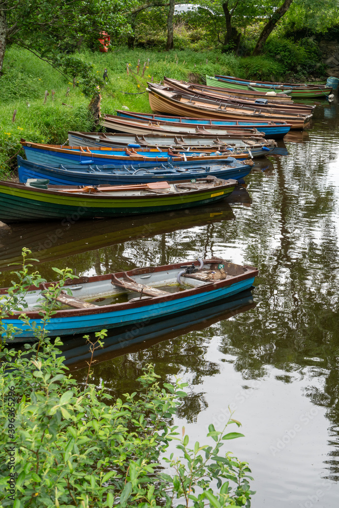 Obraz premium Boats docked at canal , Lakes of Killarney, Killarney National Park, County Kerry, Ireland near Castle Ross