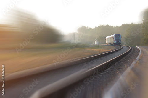 Train leaving the station on foggy morning. Industrial landscape © CrispyMedia
