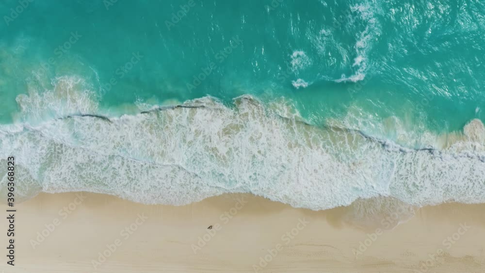 Top Down Birds Eye View of Waves Crashing on Tropical White Sand Beach. 4K Top Down Birds Eye View of Waves Crashing on Tropical White Sand Beach. 4K