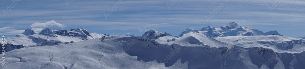 panoramic of the French Alps mountains in winter with the Mont Blanc on a fabulous day on the ski slopes of Flaines