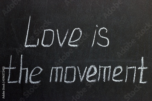  The inscription on the chalkboard "Love is movement"