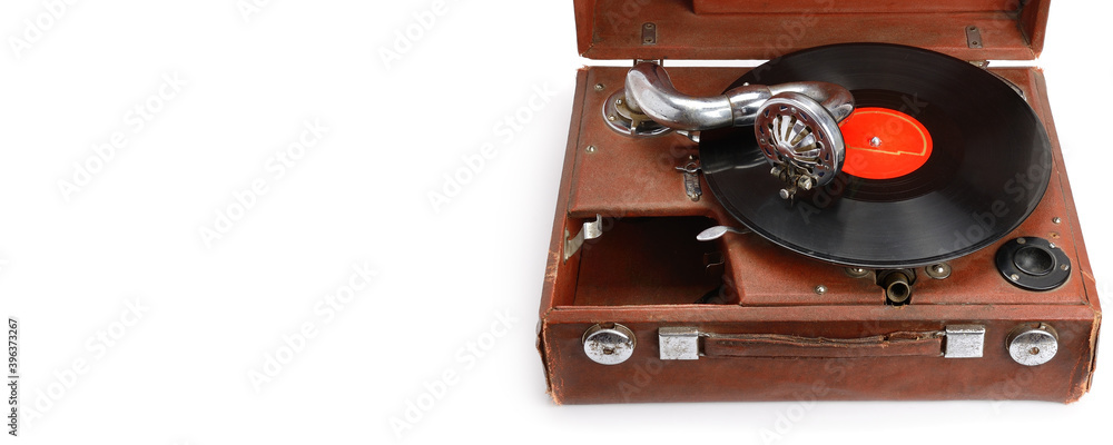 Old gramophone with plate or vinyl disk on wooden box isolated on white background. Free space for text. Wide photo. Old gramophone with plate or vinyl disk on wooden box isolated on white background. Free space for text. Wide photo.