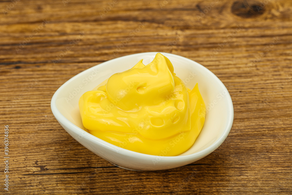 Natural cheese sauce in the bowl Natural cheese sauce in the bowl