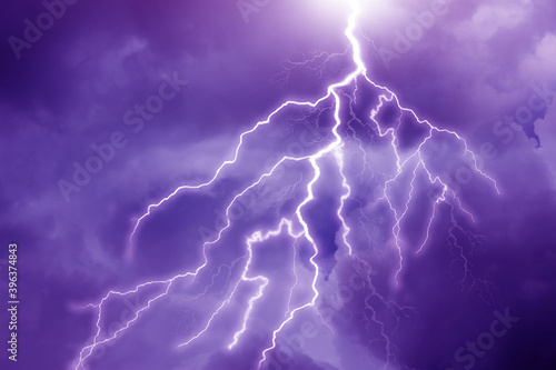 Lightning in dark cloudy sky during thunderstorm