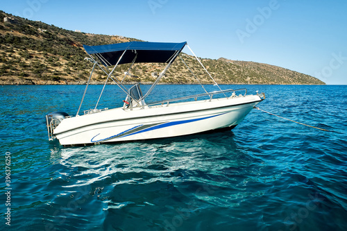 Slika na platnu Sea landscape with the self drive motor boat for rent in white and blue color on