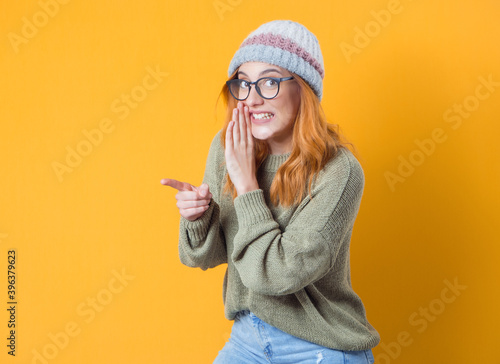Girl holding hand near mouth and telling secret, isolated on white background,gossip concept