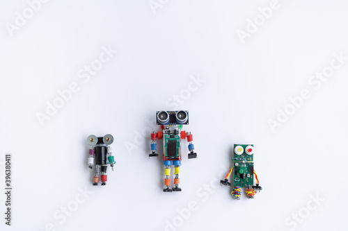 A metal robot and an electronic board that can be programmed. Robotics and electronics. DIY robotics. Mathematics, engineering, science, technology, computer code. STEM and STEAM education for kids. 