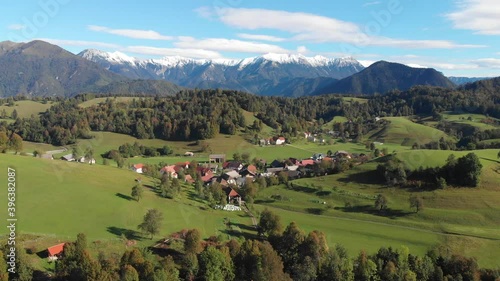 Ponikve village rural Slovenia Soca valley push in to small town lush green aerial view photo