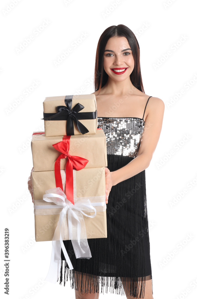 Woman in party dress holding Christmas gifts on white background Woman in party dress holding Christmas gifts on white background