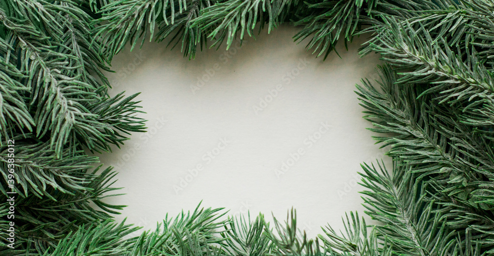 Fir branches border on white background, good for christmas backdrop Fir branches border on white background, good for christmas backdrop