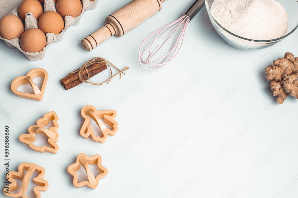 Shortcrust pastry for gingerbread.Christmas background for baking, top down view, copy space. Christmas and New Years, family celebration traditions. cinnamon, spices, flour on a white table. Shortcrust pastry for gingerbread.Christmas background for baking, top down view, copy space. Christmas and New Years, family celebration traditions. cinnamon, spices, flour on a white table.