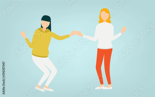拳を打ち合わせるポーズをとる二人の女性