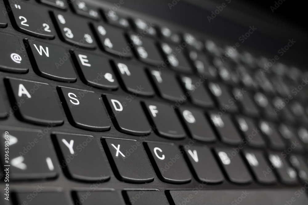 Close up of black gray laptop keyboard (diminishing perspective, selective focus on key of letter Y)