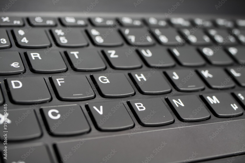 Close up of black gray laptop keyboard (diminishing perspective, selective focus on key of letter Y) Close up of black gray laptop keyboard (diminishing perspective, selective focus on key of letter Y)