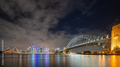Sydney, New South Wales, Australia ; Sydney skyline and Opera House illuminated at night.