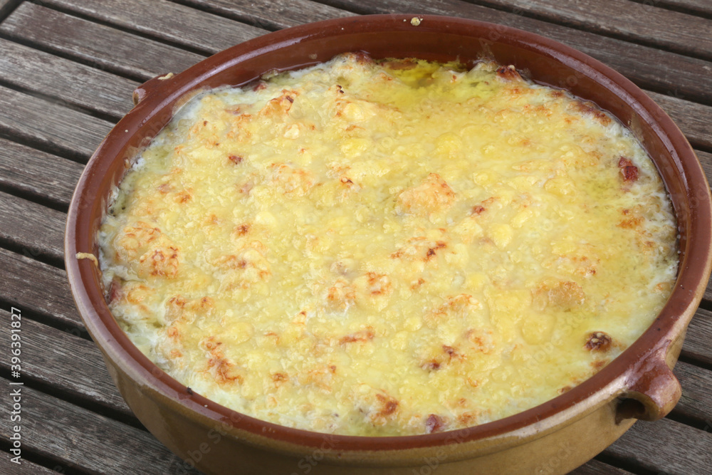 prepared meal bowl of potatoes and onion gratin as vegan food prepared meal bowl of potatoes and onion gratin as vegan food