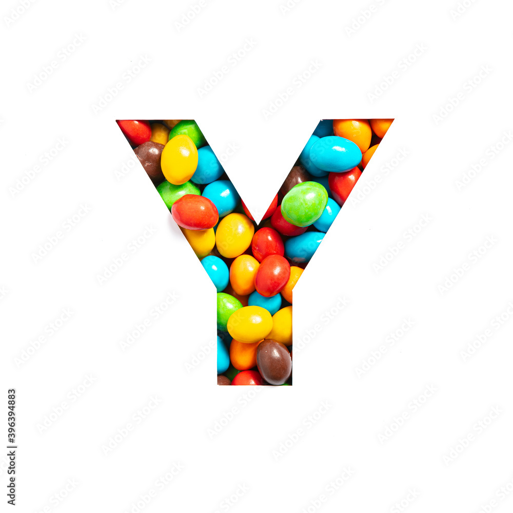 Letter Y of English alphabet of multicolored sweets and paper cut isolated on white. Typeface for festive design Letter Y of English alphabet of multicolored sweets and paper cut isolated on white. Typeface for festive design
