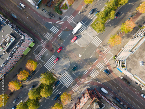 Billede på lærred Crossroad crossing aerial view in Amsterdam traffic intersection in city urban T