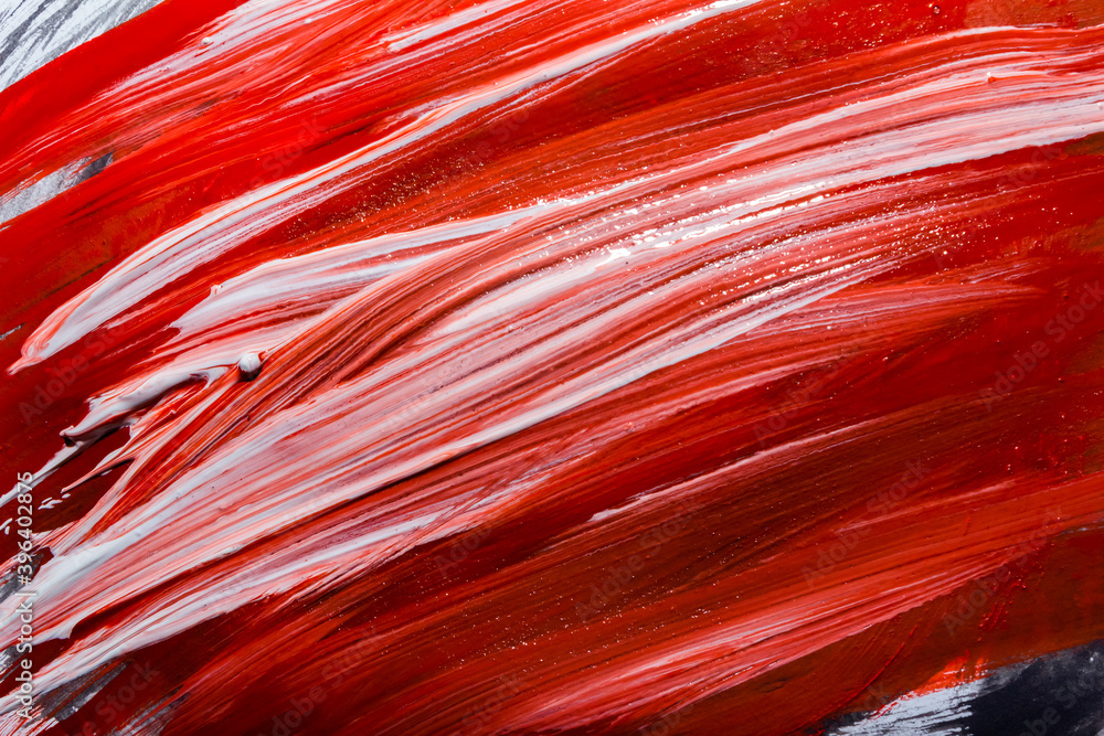 Abstract backdrop photo of red and white oil paint colors on canvas